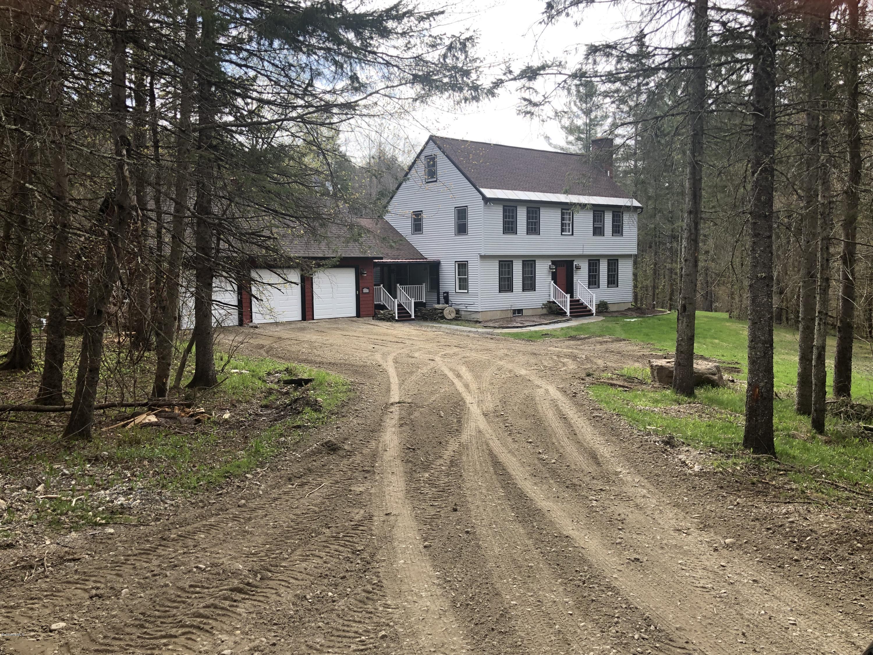 99 Middlefield Road Peru, MA 01235 - Photo 1 of 54 a view of a house with a yard and large trees