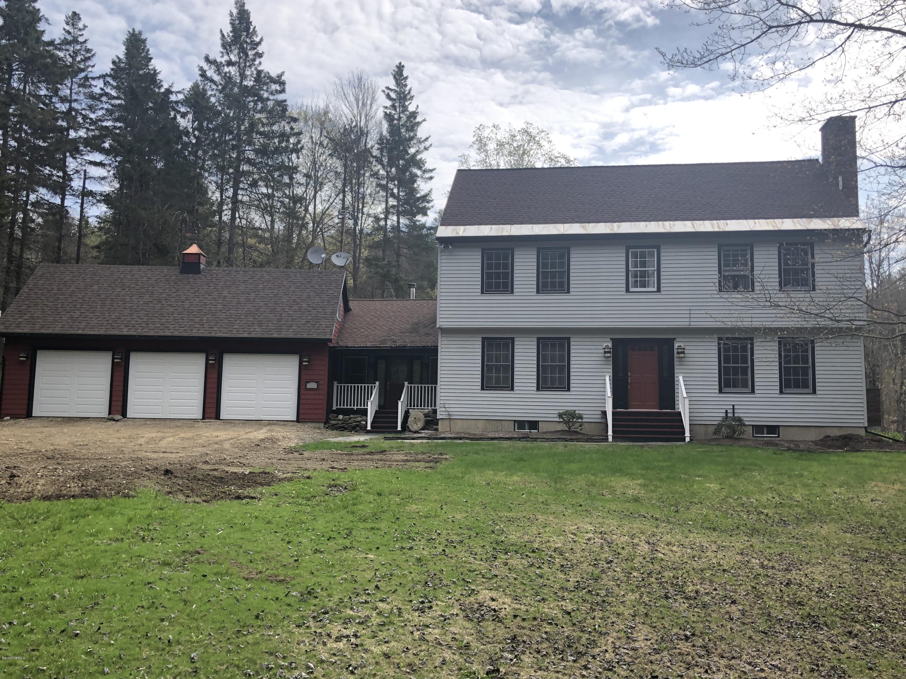 99 Middlefield Road Peru, MA 01235 - Photo 2 of 54 a front view of a house with a yard