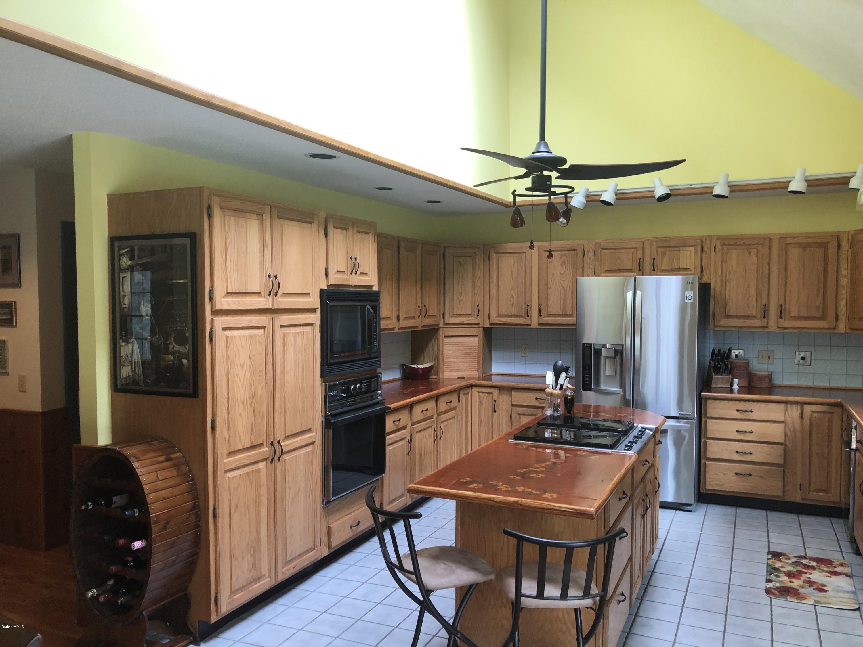 99 Middlefield Road Peru, MA 01235 - Photo 12 of 54 a kitchen with a refrigerator a sink and dishwasher