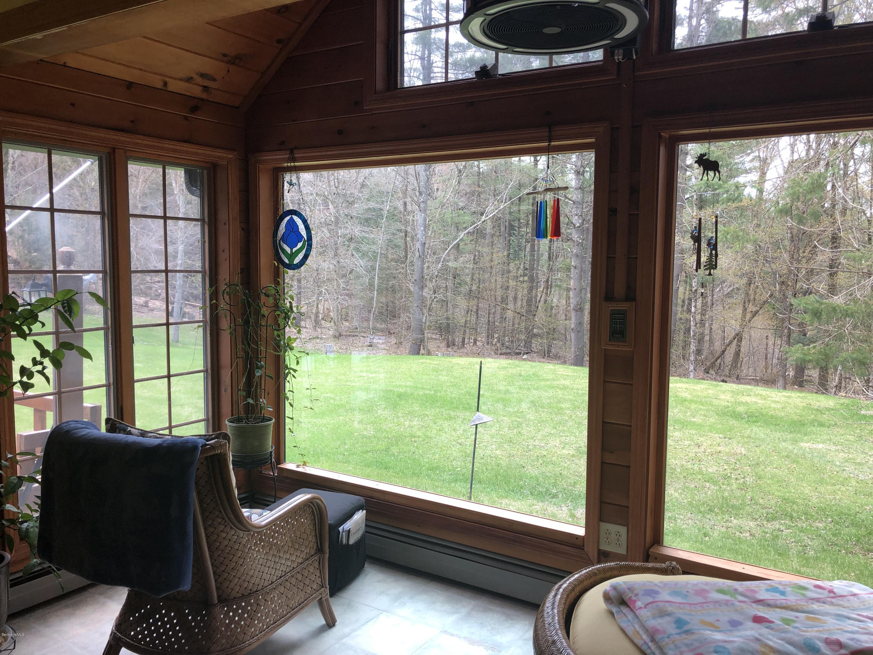 99 Middlefield Road Peru, MA 01235 - Photo 15 of 54 a living room with furniture and a floor to ceiling window