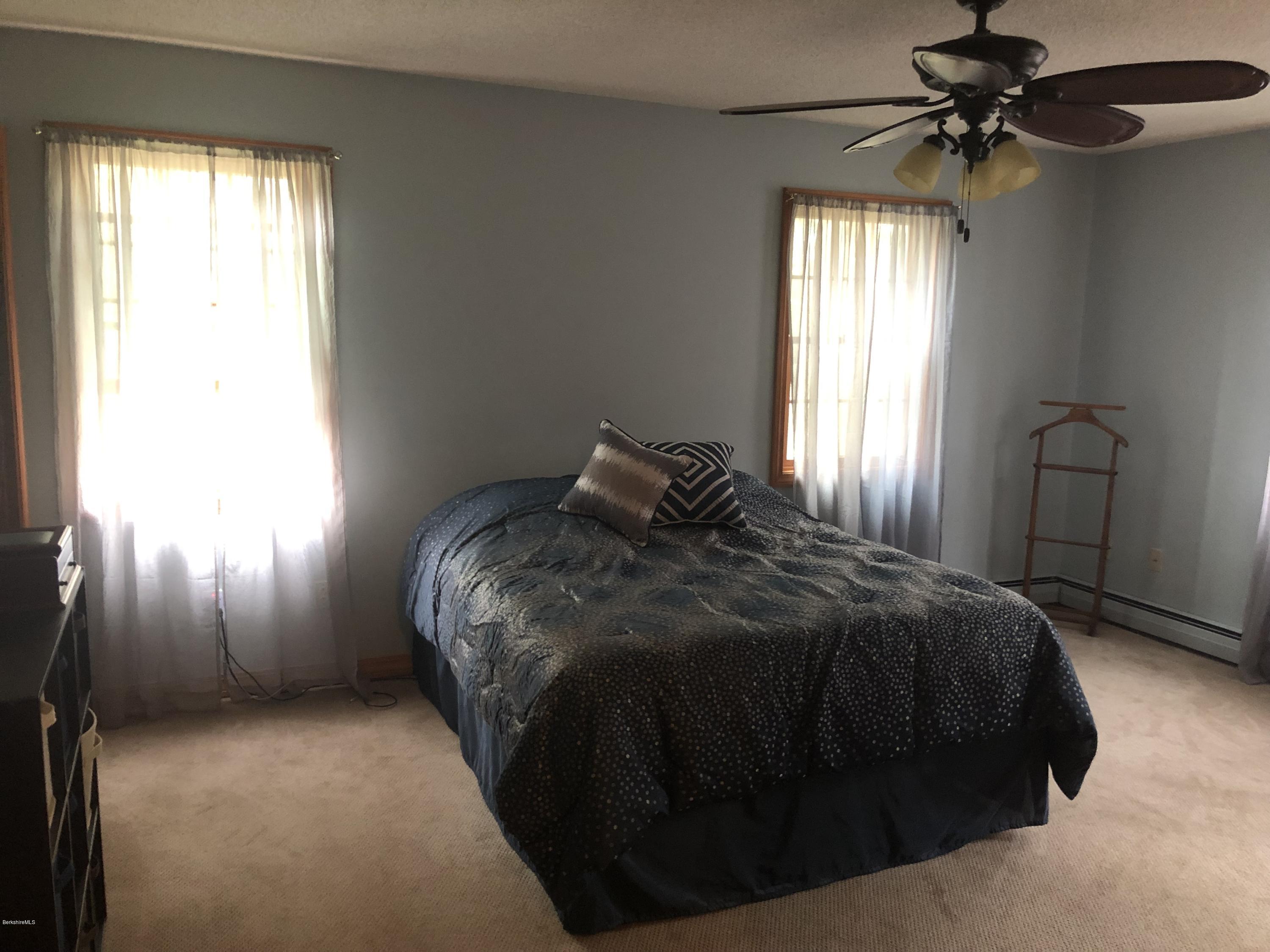 99 Middlefield Road Peru, MA 01235 - Photo 25 of 54 a bedroom with a bed and a window