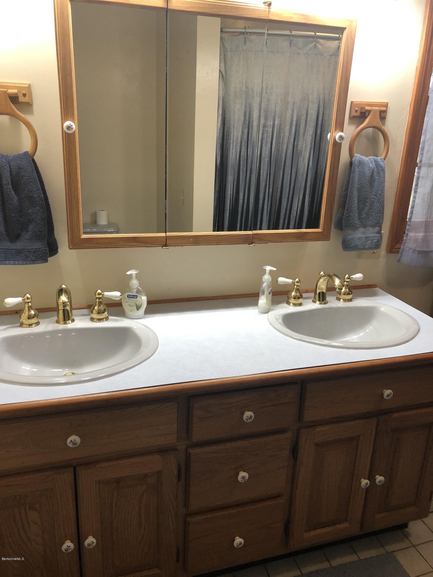 99 Middlefield Road Peru, MA 01235 - Photo 28 of 54 a bathroom with a sink and a mirror