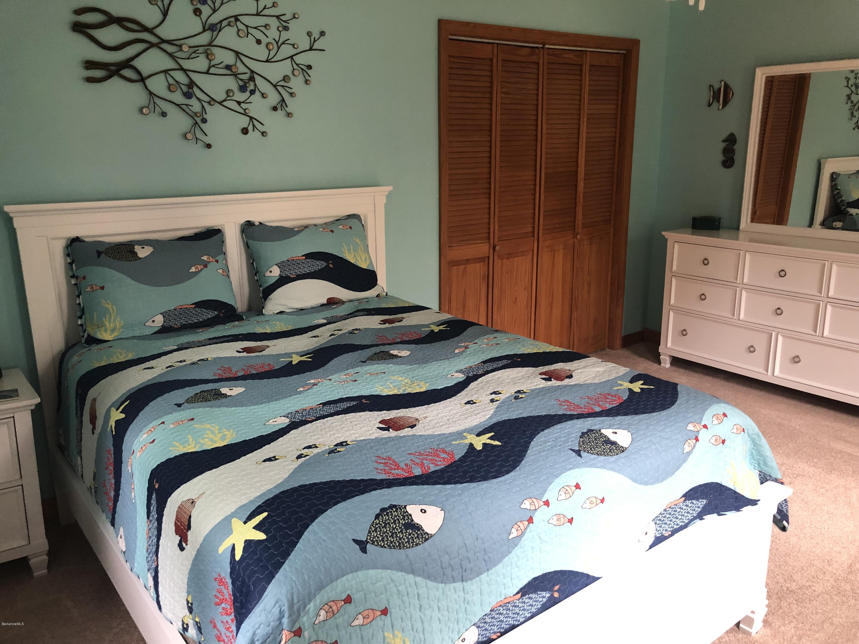 99 Middlefield Road Peru, MA 01235 - Photo 30 of 54 a bedroom with a bed and dresser