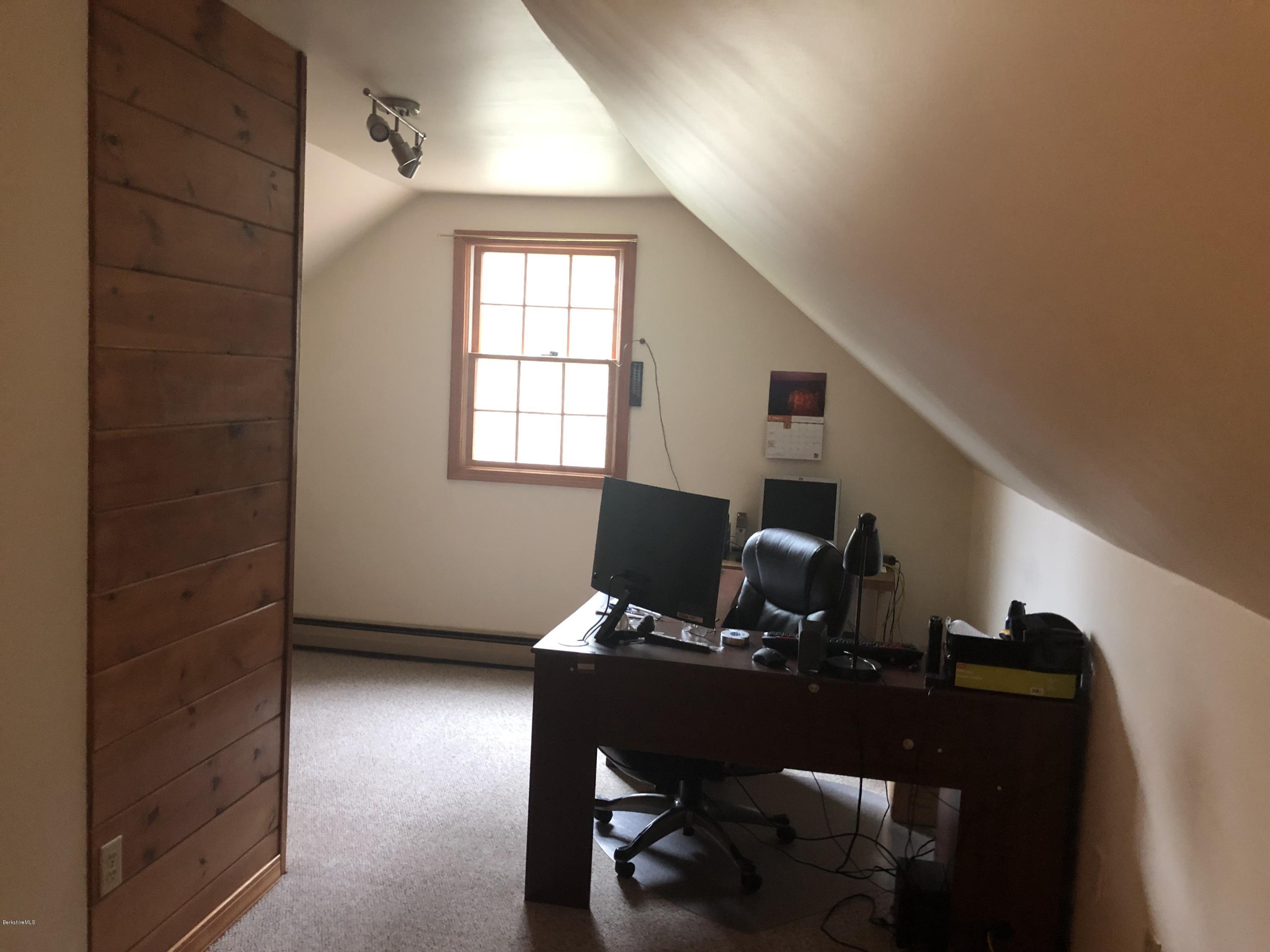 99 Middlefield Road Peru, MA 01235 - Photo 33 of 54 a view of a workspace with furniture and a window