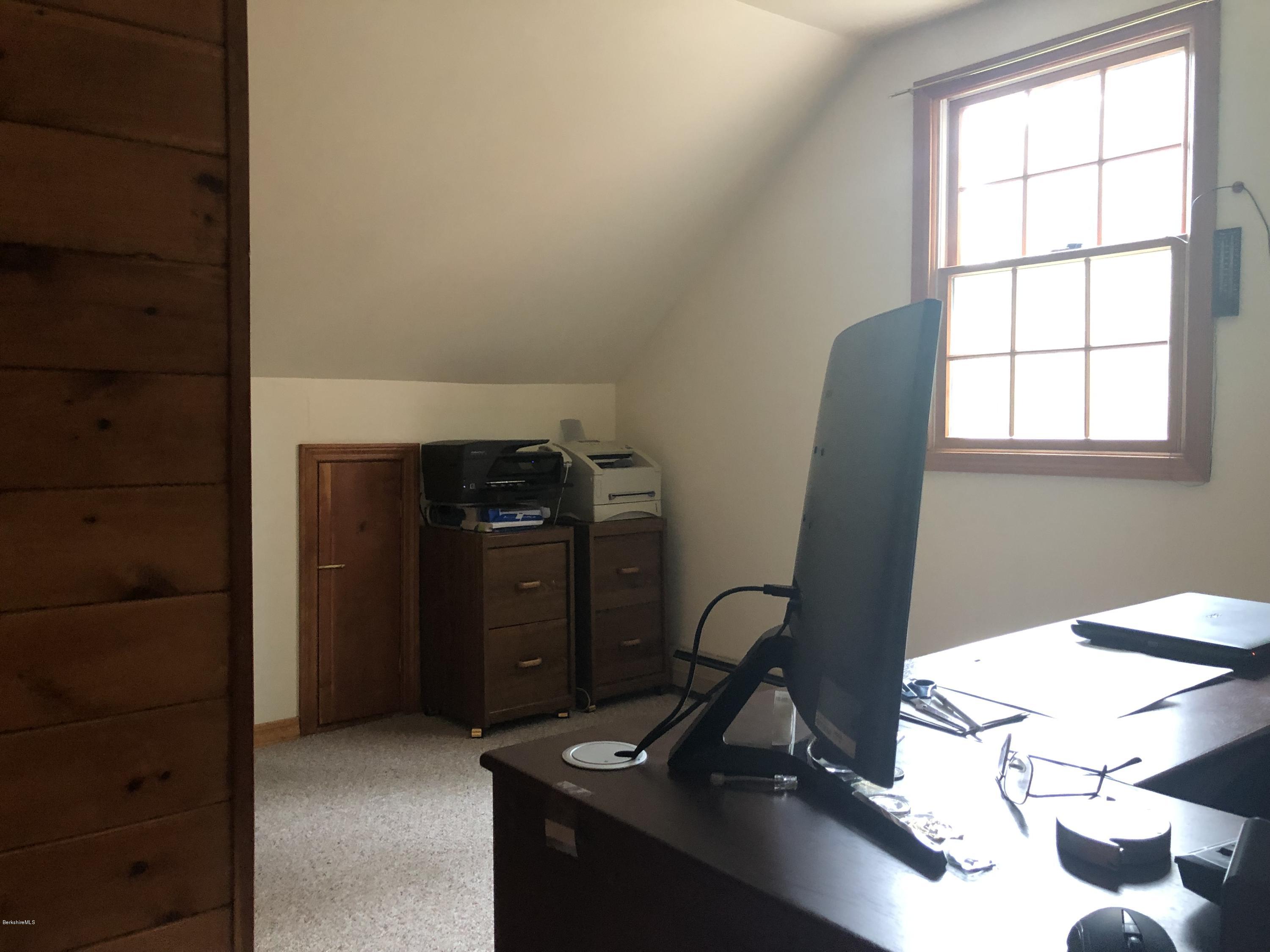 99 Middlefield Road Peru, MA 01235 - Photo 34 of 54 a view of a workspace with furniture and a window