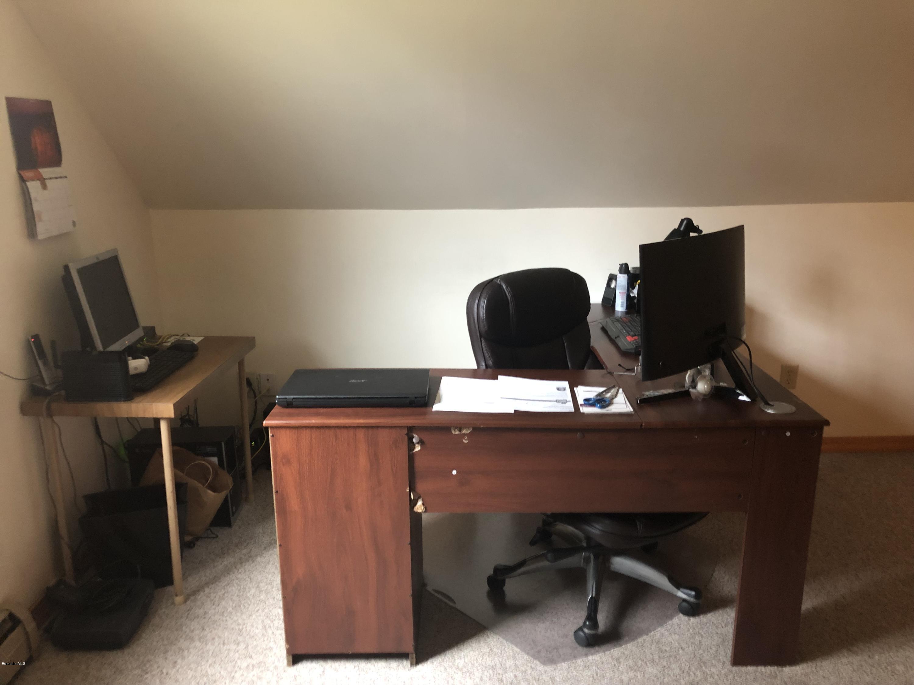 99 Middlefield Road Peru, MA 01235 - Photo 35 of 54 a desk with chair and computer on a table