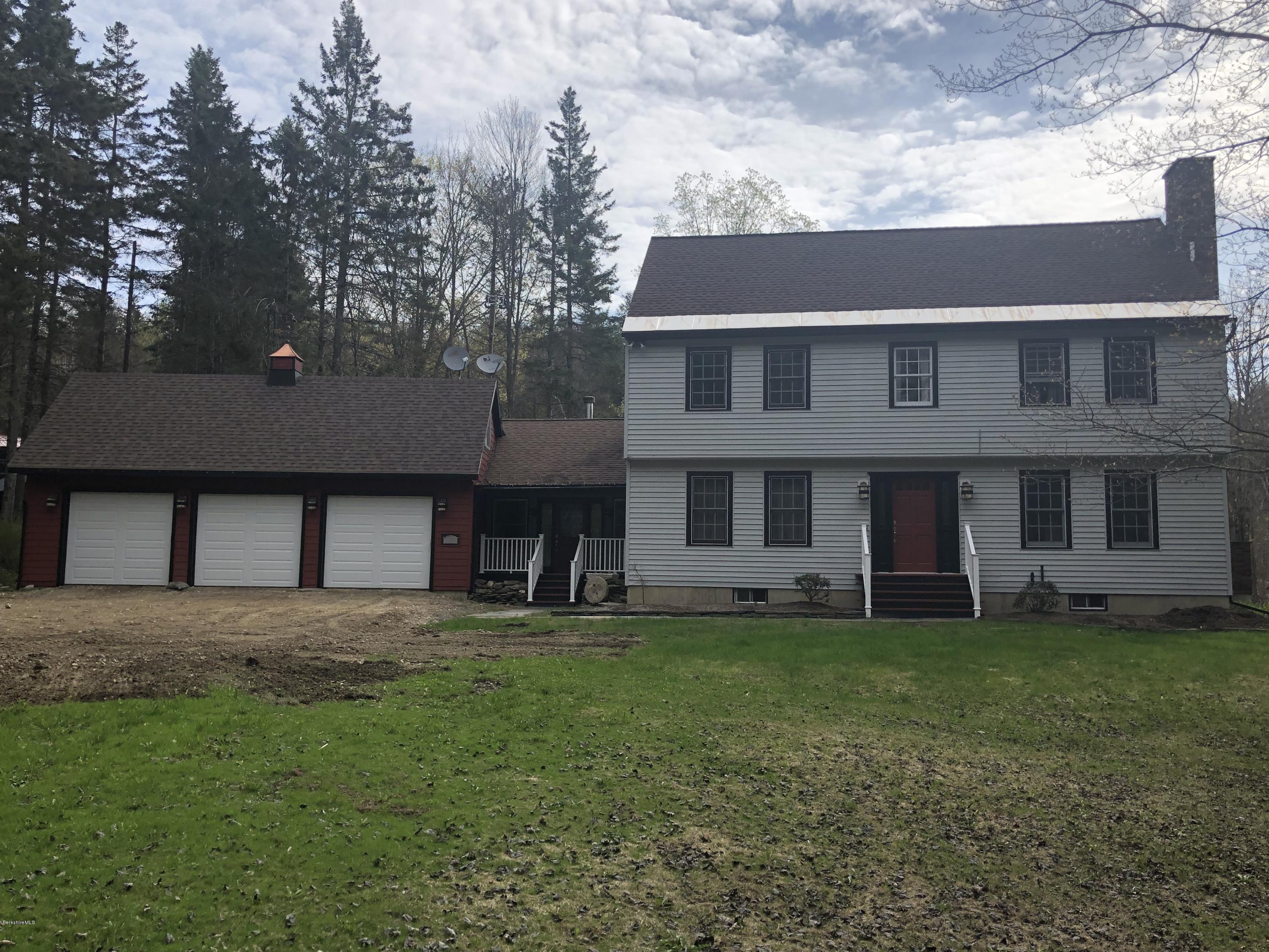 99 Middlefield Road Peru, MA 01235 - Photo 6 of 54 a front view of a house with a yard