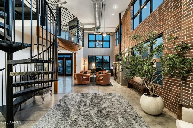a view of a porch with furniture and a potted plant