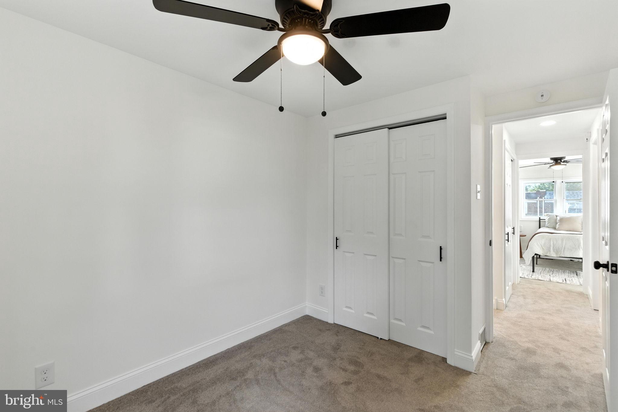 12125 Barbary Road Philadelphia, PA 19154 - Photo 16 of 26 an empty room with closet and a chandelier fan