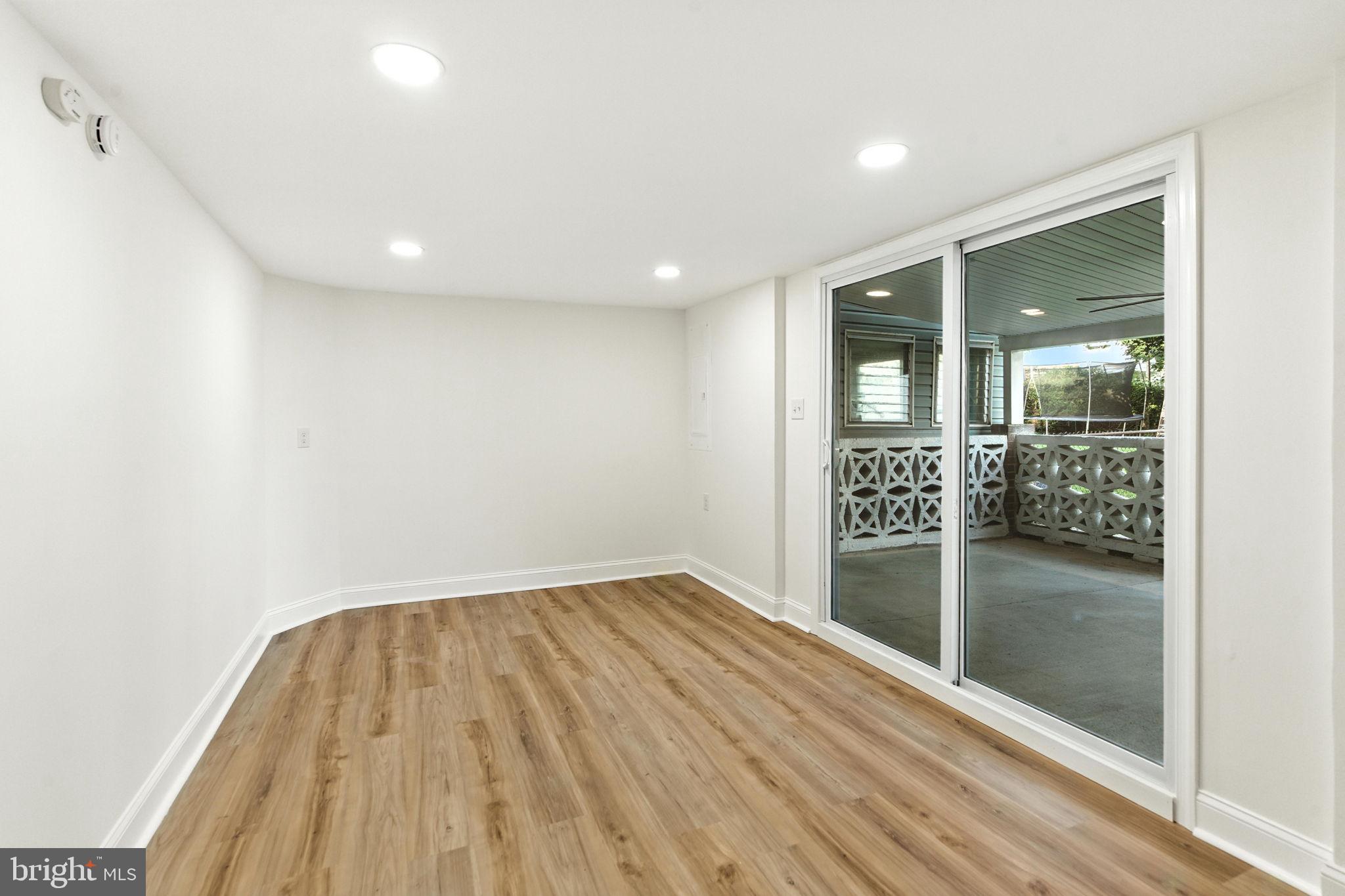 12125 Barbary Road Philadelphia, PA 19154 - Photo 19 of 26 an empty room with wooden floor and entrance