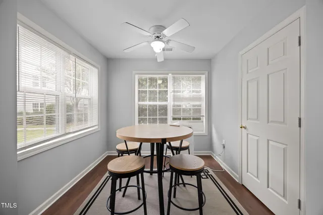 a dining room with furniture and window