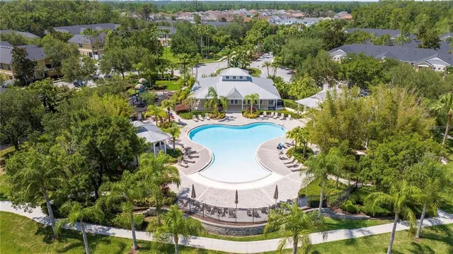 a living room with fireplace furniture and a large window