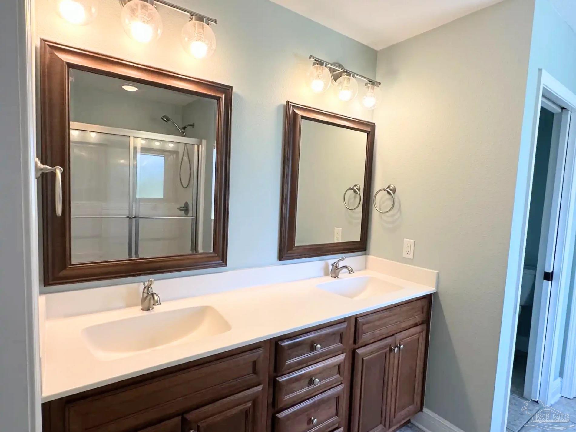 1938 Commodore Drive Navarre, FL 32566 - Photo 11 of 24 a bathroom with a sink and a mirror