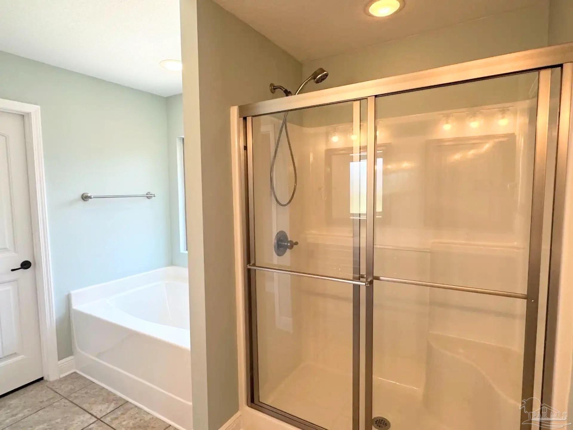 1938 Commodore Drive Navarre, FL 32566 - Photo 12 of 24 a bathroom with a glass shower door