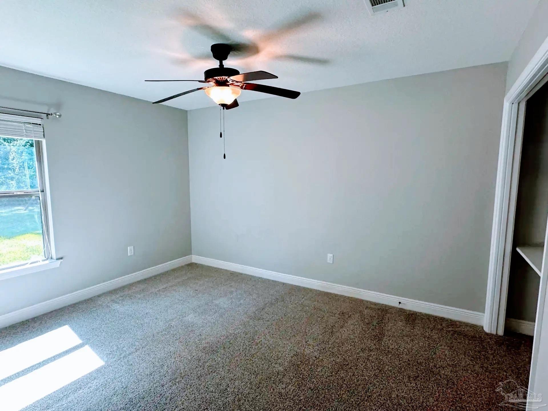 1938 Commodore Drive Navarre, FL 32566 - Photo 14 of 24 an empty room with a window