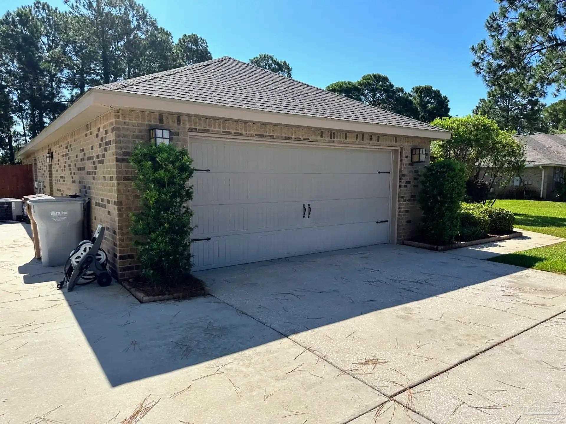 1938 Commodore Drive Navarre, FL 32566 - Photo 3 of 24 a backyard of a house with potted plants