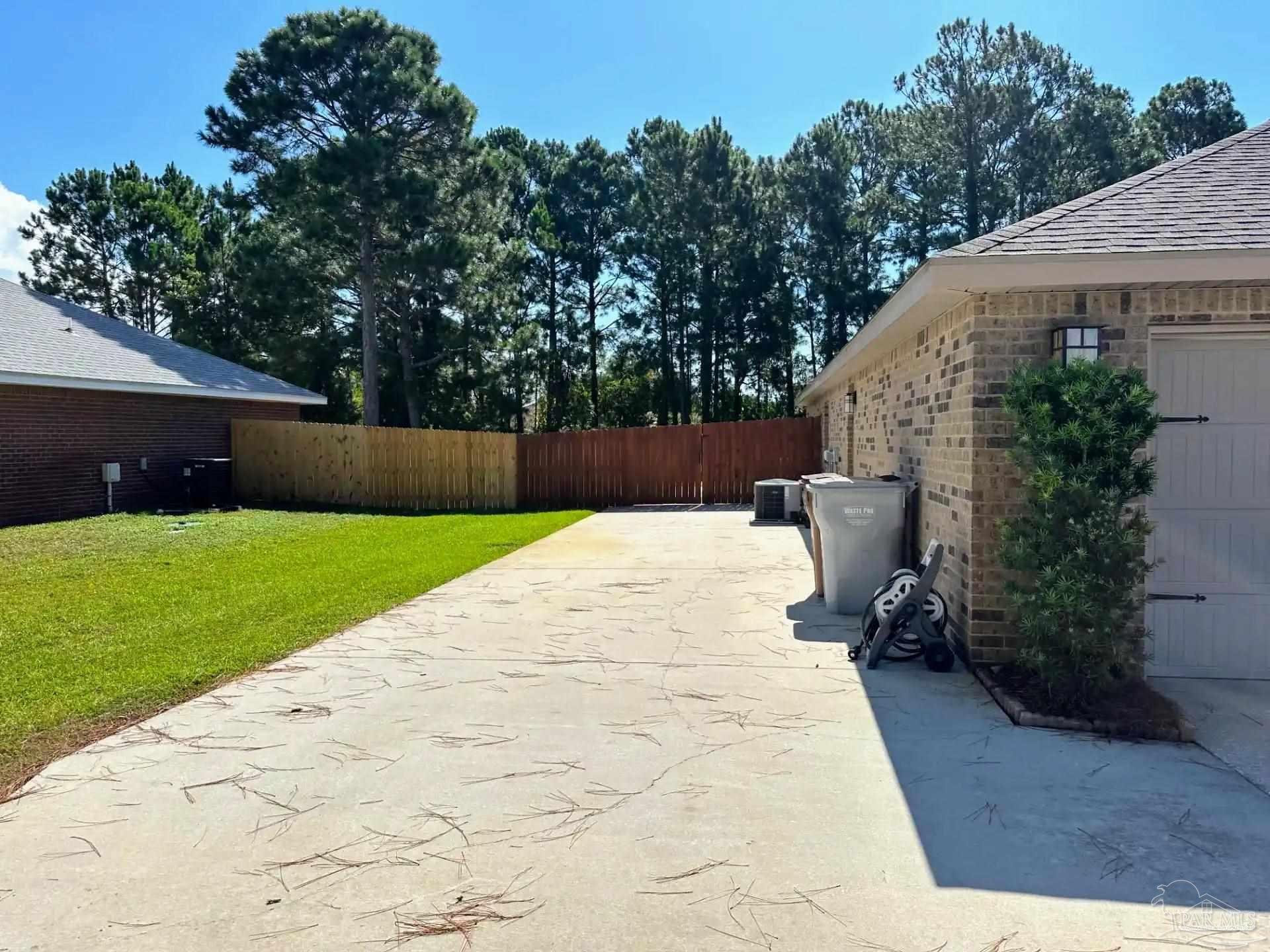 1938 Commodore Drive Navarre, FL 32566 - Photo 4 of 24 a view of backyard with green space