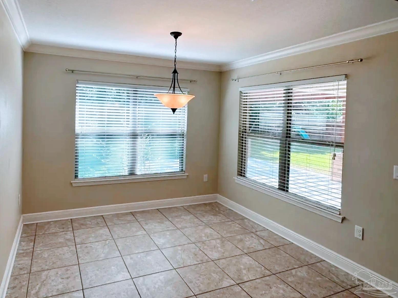 1938 Commodore Drive Navarre, FL 32566 - Photo 8 of 24 a view of an empty room with windows