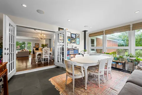 a view of a dining room with furniture window and outside view