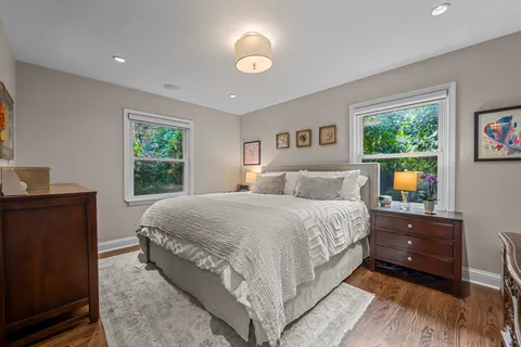 a bed room with a bed and window