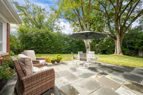 a view of swimming pool with sitting area and furniture