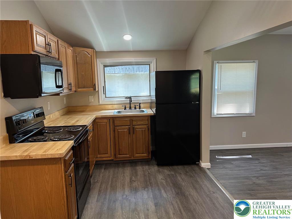 16 Grove Road Northampton, PA 18067 - Photo 4 of 11 a kitchen with a sink a stove a refrigerator and cabinets