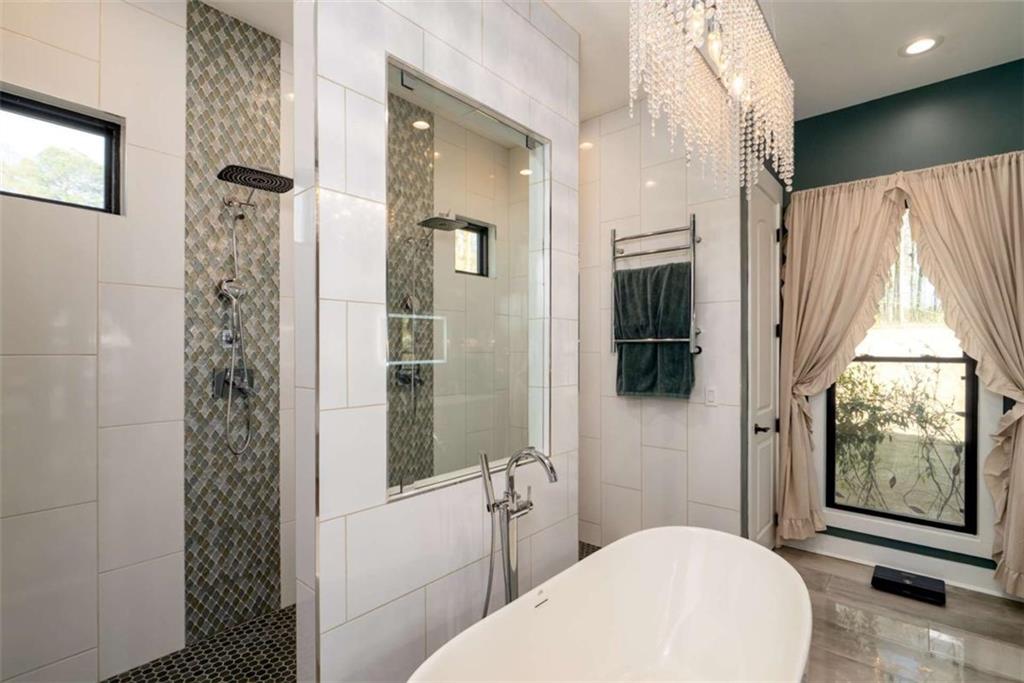 1953-1 Barton Brg Road Madison, GA 30650 - Photo 35 of 78 a bathroom with a toilet a sink and glass door