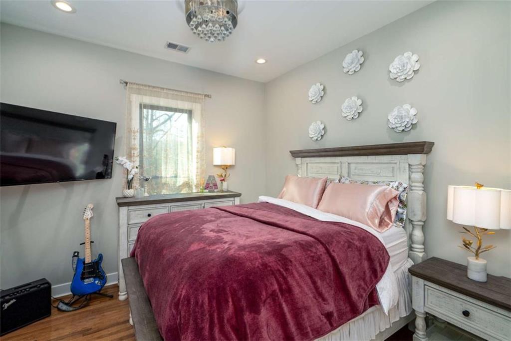 1953-1 Barton Brg Road Madison, GA 30650 - Photo 44 of 78 a bed sitting in a bedroom next to a window