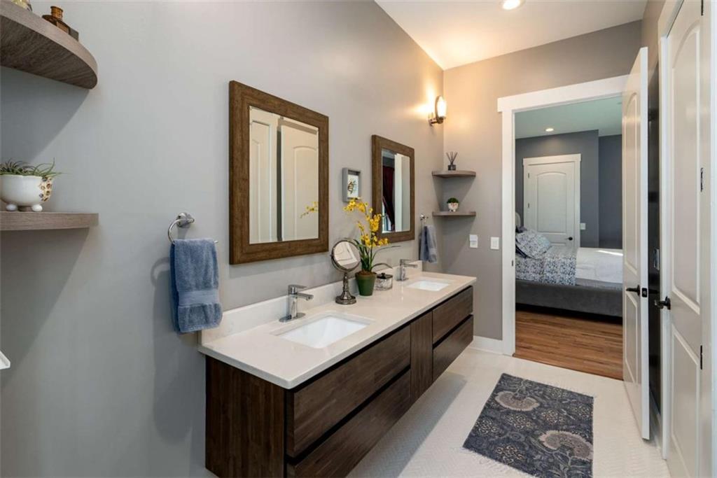 1953-1 Barton Brg Road Madison, GA 30650 - Photo 49 of 78 a en suite bathroom with a sink and a mirror