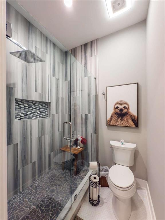 1953-1 Barton Brg Road Madison, GA 30650 - Photo 50 of 78 a bathroom with a toilet a sink and a shower