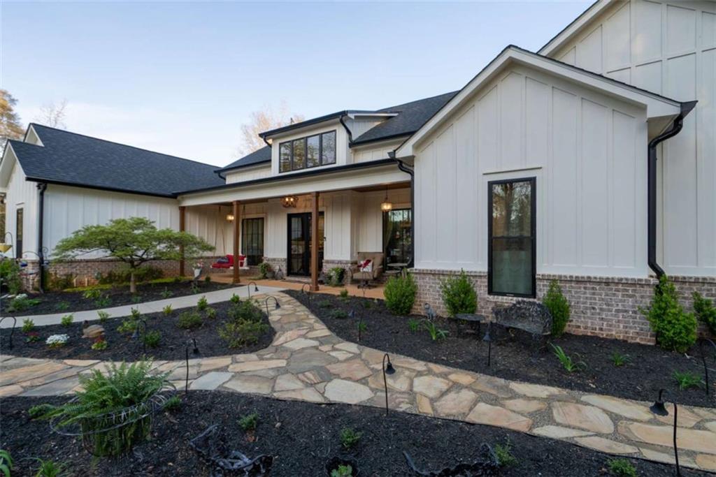 1953-1 Barton Brg Road Madison, GA 30650 - Photo 8 of 78 a front view of a house with garden and plants