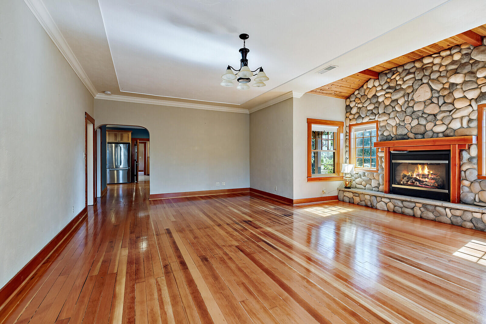 4450 Fern Valley Road Medford, OR 97504 - Photo 69 of 74 a view of an empty room with wooden floor fireplace and a window