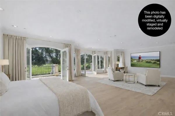 a bedroom with a large bed and a couch