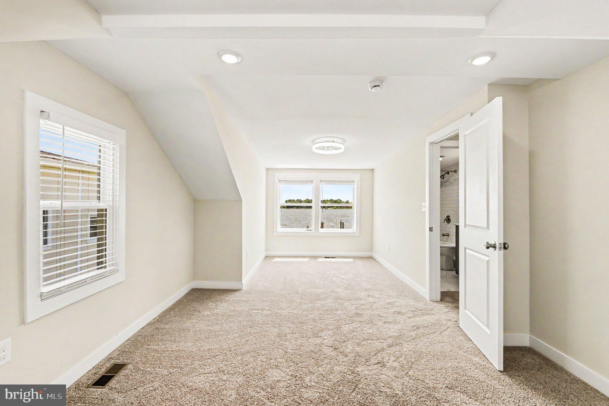 9135 Cuckold Point Road Sparrows Point, MD 21219 - Photo 20 of 44 a big room with windows and closet