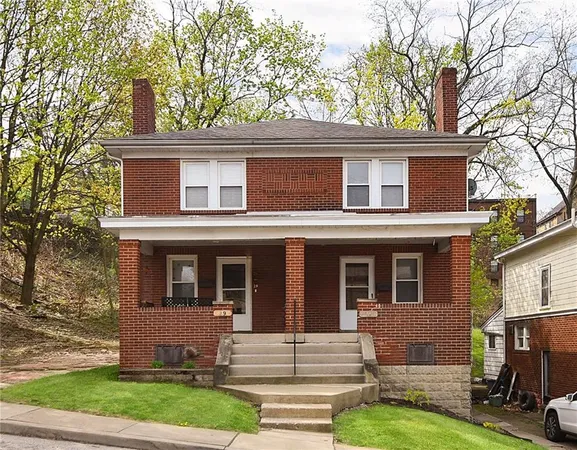 front view of a house with a yard
