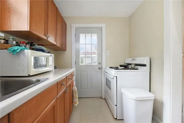 a kitchen with a stove and a microwave