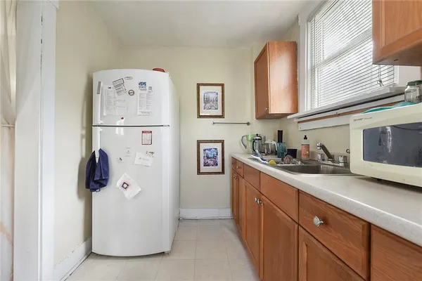 a kitchen with stainless steel appliances granite countertop a refrigerator and a stove