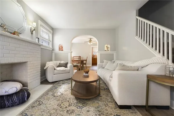 a living room with furniture and a fireplace