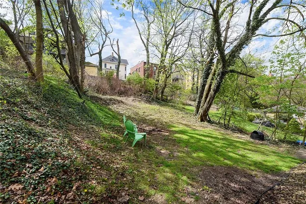 a backyard of a house with lots of green space