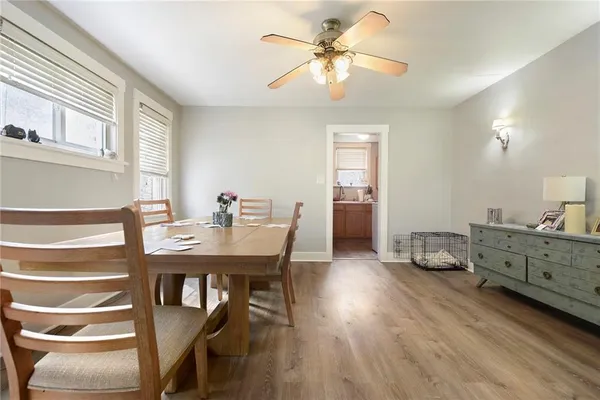 a view of a dining room with furniture window and wooden floor