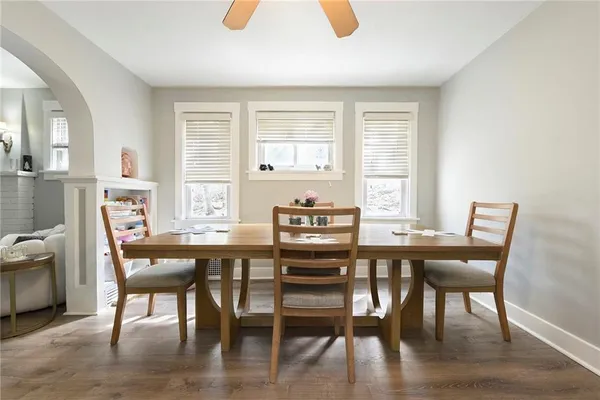 a view of a dining room with furniture window and wooden floor