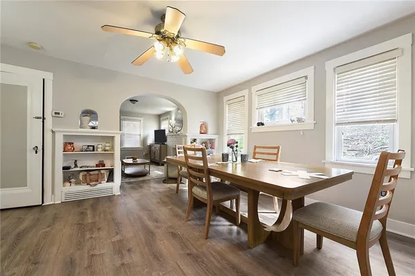 a view of a dining room with furniture and chandelier