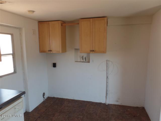 5384 Highway 260 Show Low, AZ 85901 - Photo 5 of 13 a room with cabinets and a window