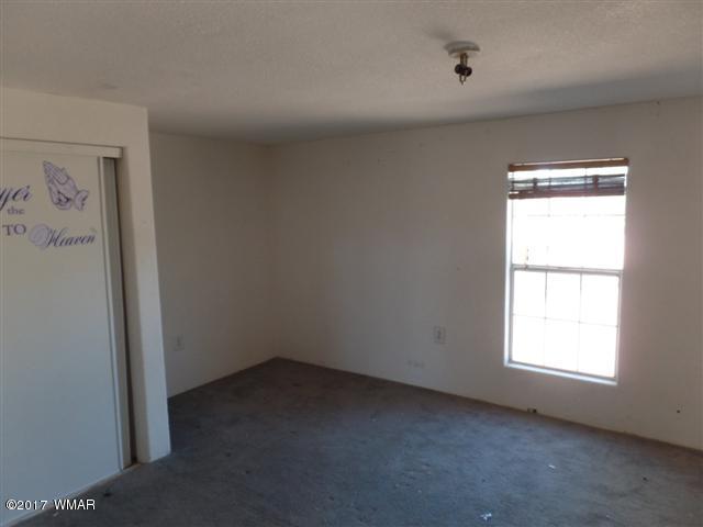 5384 Highway 260 Show Low, AZ 85901 - Photo 7 of 13 an empty room with a window