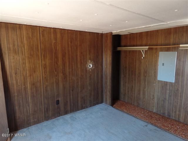 5384 Highway 260 Show Low, AZ 85901 - Photo 9 of 13 a view of a garage with wooden walls