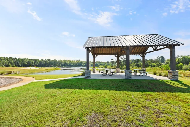 a view of a swimming pool and a yard