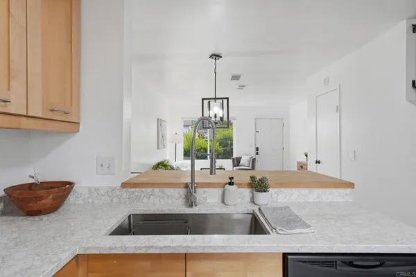 a kitchen with a sink and a window