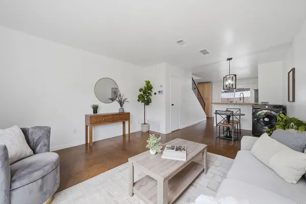 a living room with furniture and a table