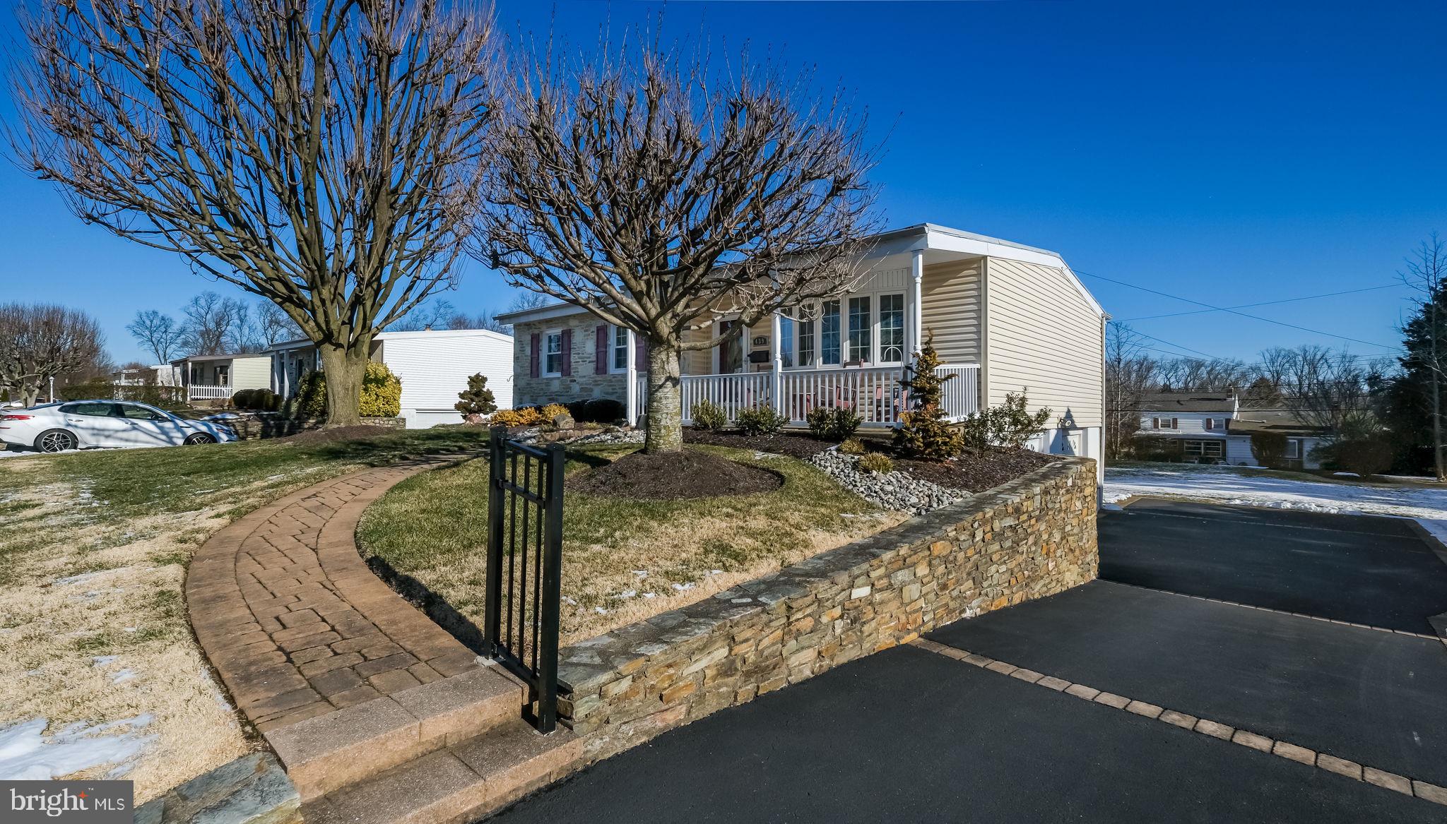 Attractive stone wall and large driveway