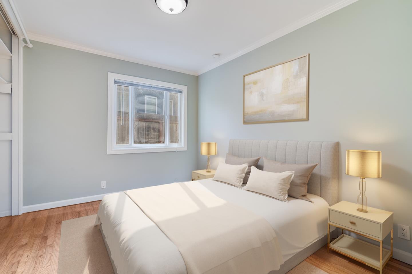 1419 Madeira Drive Pacifica, CA 94044 - Photo 11 of 66 a bedroom with a bed and a lamp on dresser